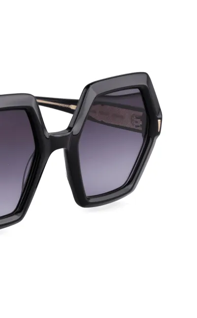 Black hexagonal oversized sunglasses close-up