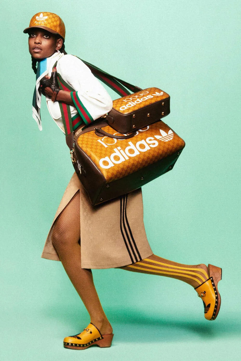 Gucci x adidas lookbook photo of a model with an adidas bag